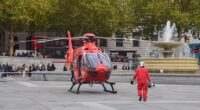 A 57-year-old man has been rushed to hospital after being hit by a falling 'cast iron decorative ball' in London's Piccadilly Circus