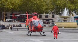 A 57-year-old man has been rushed to hospital after being hit by a falling 'cast iron decorative ball' in London's Piccadilly Circus