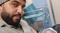 Jihad Al-Shamie, 35, who was shot dead minutes after he targeted Heaton Park Synagogue in Manchester yesterday. It is believed he was a father and is pictured holding a child