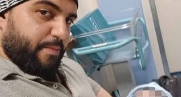 Jihad Al-Shamie, 35, who was shot dead minutes after he targeted Heaton Park Synagogue in Manchester yesterday. It is believed he was a father and is pictured holding a child