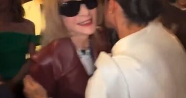 Meghan looks in her element as she embraces Vogue's global editorial director Anna Wintour