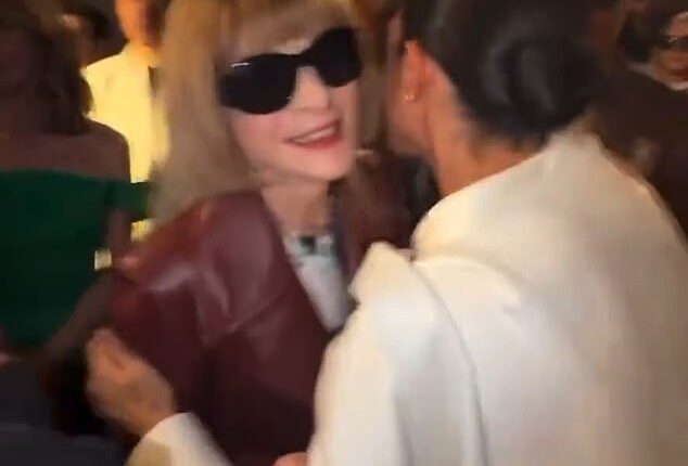 Meghan looks in her element as she embraces Vogue's global editorial director Anna Wintour
