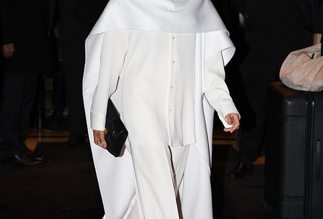 Meghan Markle cut a stylish figure on Saturday as she was pictured in Paris for Fashion Week while being flanked by bodyguards