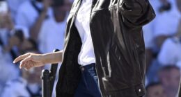 First Lady Melania Trump, 55, cut a casual-cool figure as she joined her husband in Virginia for the celebration of the U.S. Navy's 250th birthday on Sunday - as she issued a rallying cry to the crowd