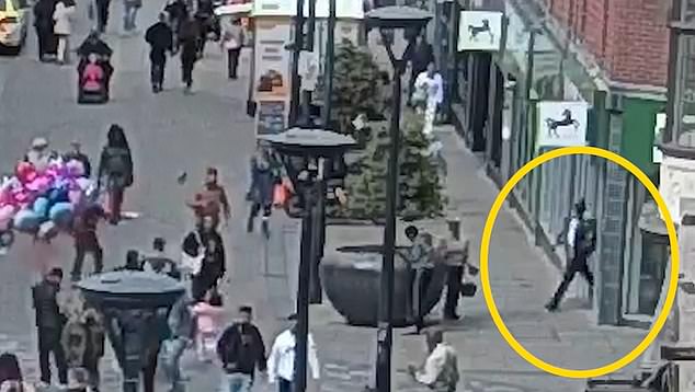 This is the moment 'wicked' Channel migrant walked out of a bank after randomly stabbing a customer to death inside because his asylum claim was rejected