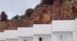 Moment rocks come crashing down on Ibiza hotel in front of screaming British tourists, injuring three people and trapping others as party island is hit by intense storm