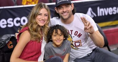 Former USC Trojans and NFL quarterback Mark Sanchez, right, with his wife Perry and son Daniel attend the game against the UCLA Bruins at Galen Center on January 27, 2024