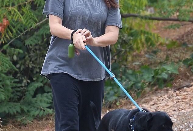 An actress who starred in the popular noughties show Two And A Half Men kept it casual for a weekend dog walk in Los Angeles