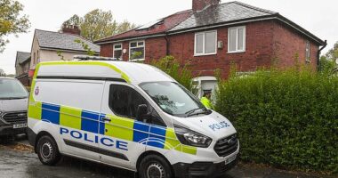 Police officers outside a home in Farnworth area of Bolton which was raided in connection with the terror attack at a Manchester synagogue