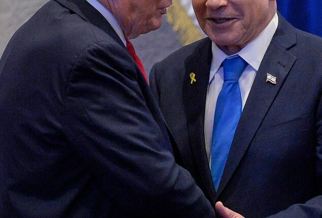 President Donald Trump talks with Israel's Prime Minister Benjamin Netanyahu at the Knesset, Israel's parliament, Monday, Oct. 13, 2025, in Jerusalem.