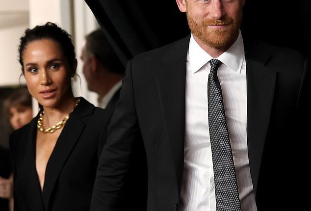 Prince Harry and Meghan Markle walked hand-in-hand as they arrived at a glitzy ceremony in New York where they are to receive an award for their humanitarian work