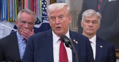Robert F Kennedy Jr was seen using a cough to covertly put something in his mouth - which appeared to be a nicotine pouch or gum - at a press conference with the president Tuesday