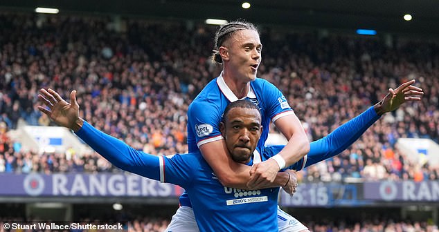Derek Cornelius enjoys the  moment with Thelo Aasgaard after scoring the opener at Ibrox