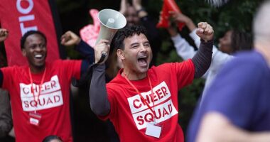 Ryan Thomas is pictured cheering on volunteers after he collaborated with the RVS to help spread the word about how rewarding the volunteering experience can be