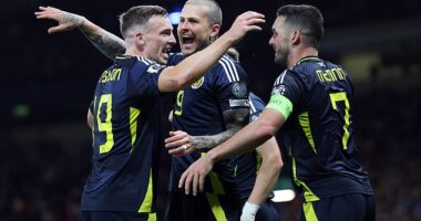 Lyndon Dykes, centre, celebrates with Ferguson and McGinn after scoring the third goal