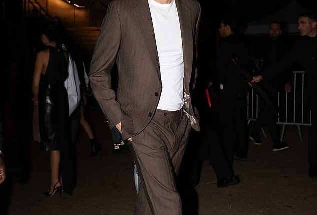 Sacha Baron Cohen looked in good spirits as he enjoyed an evening out at the Grand Palais in Paris on Friday