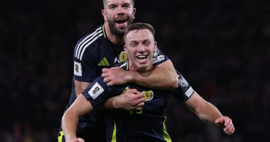 Lewis Ferguson (front) is hailed by Grant Hanley after firing the home side in front