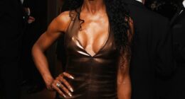 Sinitta wowed in a plunging metallic gold dress at the star-studded Variety Club Awards on Sunday - accompanied by her supportive brood