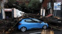 Storm Amy batters Britain with cars smashed and trees downed as weather warning extended