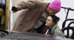 Strictly star Amber Davies was 'unfazed' by photos of her pro dance partner Nikita Kuzmin kissing her on the forehead, sources revealed to the Daily Mail