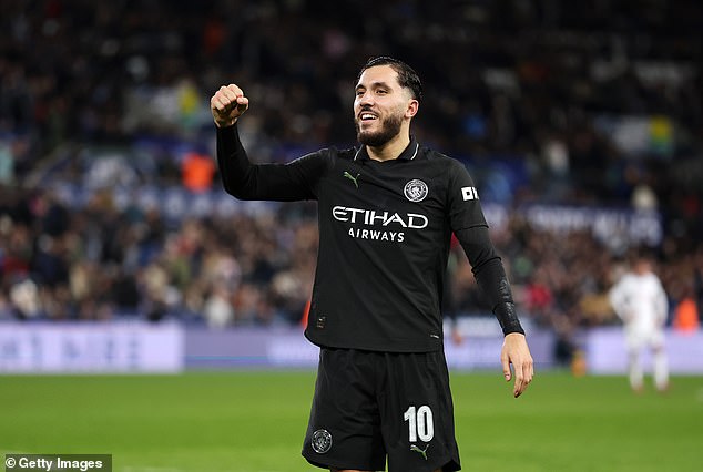 Rayan Cherki celebrates sealing victory for Manchester City against Swansea on Wednesday