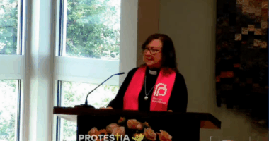 Rebecca Todd Peters speaking in Planned Parenthood garb
