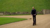 Joining Eugene Levy on the Apple+ TV series The Reluctant Traveler, Prince William , 43, revealed his preferred mode of transport for moving through the royal grounds - an electric scooter