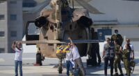 Omri Miran, an Israeli hostage released from the Gaza Strip gestures after coming off a helicopter at the Ichilov Hospital, in Tel Aviv, Israel, Monday, Oct. 13, 2025