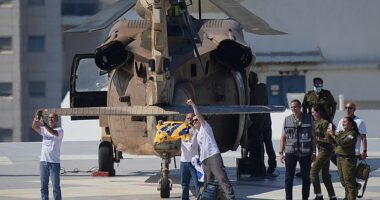 Omri Miran, an Israeli hostage released from the Gaza Strip gestures after coming off a helicopter at the Ichilov Hospital, in Tel Aviv, Israel, Monday, Oct. 13, 2025