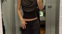 A $20 brown polka-dot top from Kmart is quickly becoming this season's most talked-about wardrobe essential. Pictured: Content creator Hannah Rogers wearing the garment in her recent Kmart clothing haul