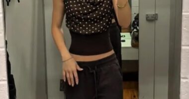 A $20 brown polka-dot top from Kmart is quickly becoming this season's most talked-about wardrobe essential. Pictured: Content creator Hannah Rogers wearing the garment in her recent Kmart clothing haul