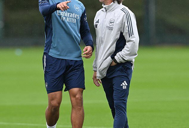 Gabriel Heinze and William Saliba (left) talk defensive tactics in an Arsenal training session