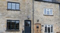 Pictured: One of the houses that has been installed with a black front door and black windows. The changes have not sat well with some residents who feel it is not in character with the area