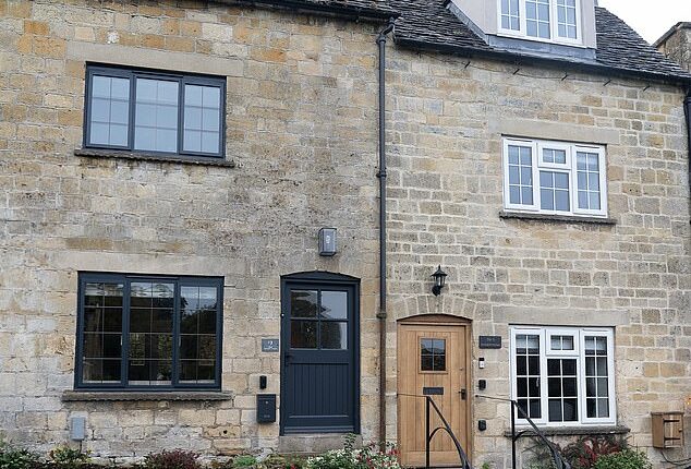 Pictured: One of the houses that has been installed with a black front door and black windows. The changes have not sat well with some residents who feel it is not in character with the area