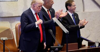 US President Donald Trump arrives to address the Knesset, with Amir Ohana, Speaker of the Israeli Knesset, and Israeli President Isaac Herzog on October 13, 2025, in Jerusalem