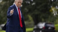 Donald Trump returns to the Oval Office from Marine One on the South Lawn of the White House in Washington, DC, on Friday