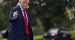 Donald Trump returns to the Oval Office from Marine One on the South Lawn of the White House in Washington, DC, on Friday
