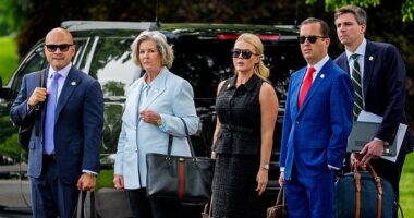 From left: Aide Walt Nauta, White House Chief of Staff Susie Wiles, White House press secretary Karoline Leavitt, Assistant to the President Sergio Gor, and an aide, wait for US President Donald Trump to board Marine One on the South Lawn before joining him on May 1