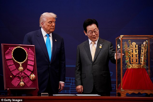 President Donald Trump (center left) was gifted a golden crown (right) by South Korean President Lee Jae Myung (center right) and the Grand Order of Mugunghwa (left), South Korea's top honor, for his efforts trying to achieve a denuclearization deal with North Korea