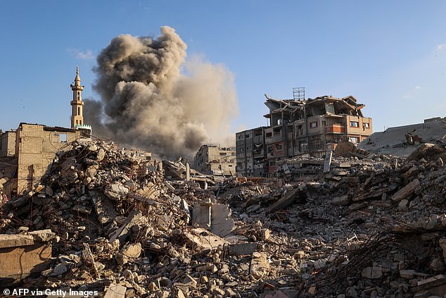Smoke billows following an Israeli strike that targeted a building in the Bureij camp for Palestinian refugees in the central Gaza Strip on October 19, 2025