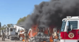 Two dead after plane crashes into trailers near Texas airfields as nearby building goes up in flames