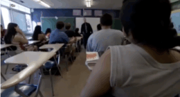 Wisconsin high school students and their teacher in the classroom.