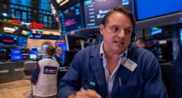 Traders work on the floor of the New York Stock Exchange on October 17