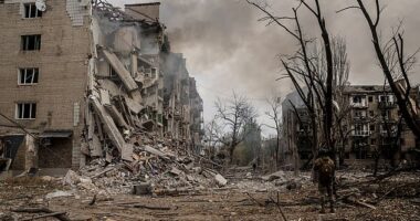 A Ukrainian serviceman stands among the rubble in the courtyard of destroyed residential buildings in the frontline town of Kostyantynivka, Donetsk region, on Sunday