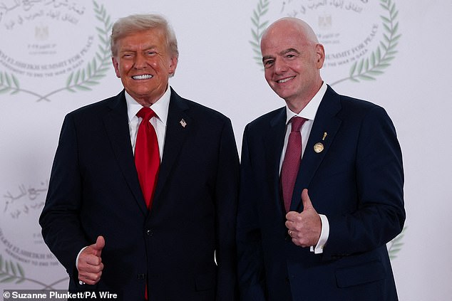 US President Donald Trump and FIFA president Gianni Infantino (right) pose for a photo at the Sharm El Sheikh Peace Summit in Egypt today