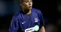 A woman has officially been charged after former Bournemouth player Jordan Chiedozie lost his leg in a motorway crash