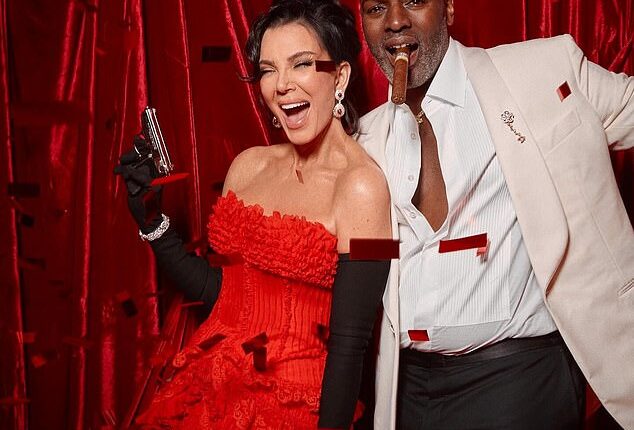 Kris Jenner, 70, looked like the ultimate Bond girl as she brandished a pistol at her 007-themed birthday party