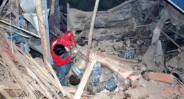 A rescuer works following an earthquake at an unidentified location in Afghanistan, in this handout image released November 3, 2025