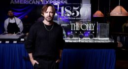 Aaron Paul, seen here at The Only at 1850 by American Express party in Las Vegas Thursday, exclusively told the Daily Mail why he and his family moved to Paris