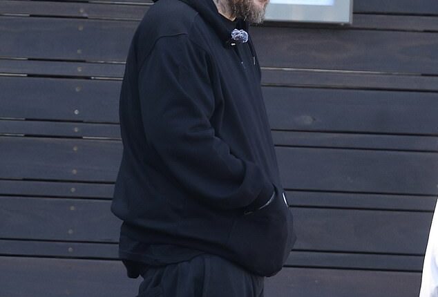 US-born rapper Jelly Roll has taken to social media claiming he was 'treated like a criminal' after entering an upscale fashion house in Sydney. Pictured in Sydney on Wednesday